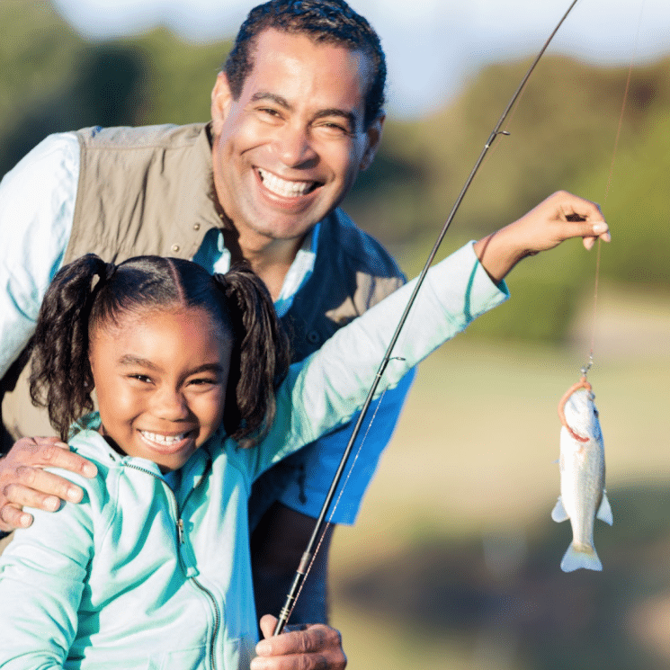 Father fishing with daughter