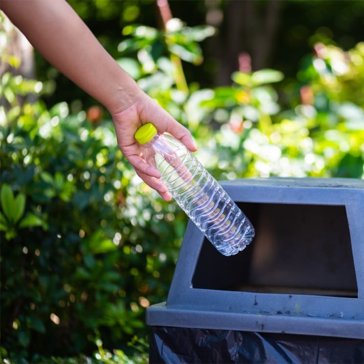 Putting litter in the trashcan